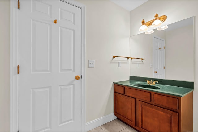 bathroom with tile patterned flooring, vanity, and baseboards