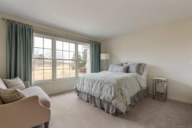 bedroom featuring carpet flooring and baseboards