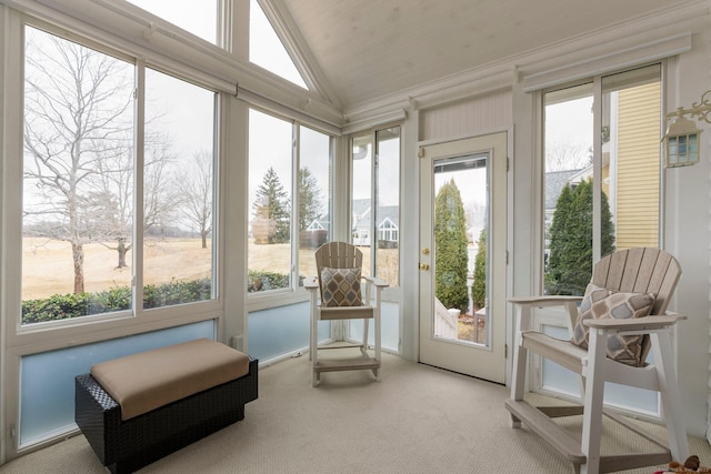 sunroom / solarium with a wealth of natural light and vaulted ceiling