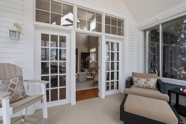 sunroom / solarium with lofted ceiling and french doors