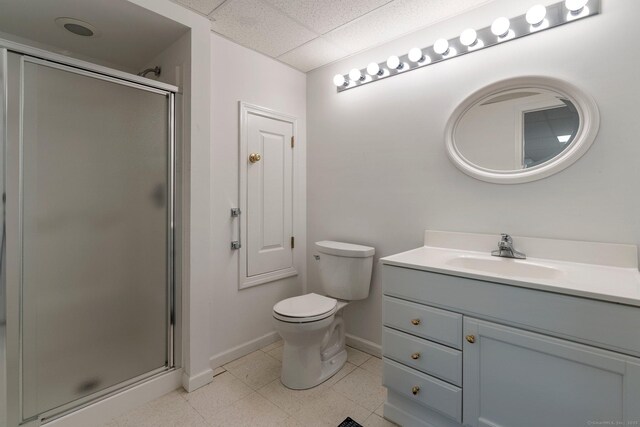 full bathroom featuring toilet, a shower stall, baseboards, and vanity