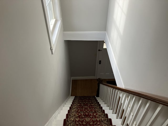 stairway with baseboards