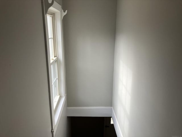 unfurnished room featuring baseboards