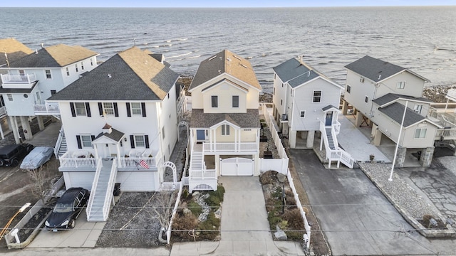 bird's eye view featuring a residential view and a water view