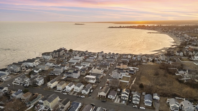 drone / aerial view with a residential view and a water view