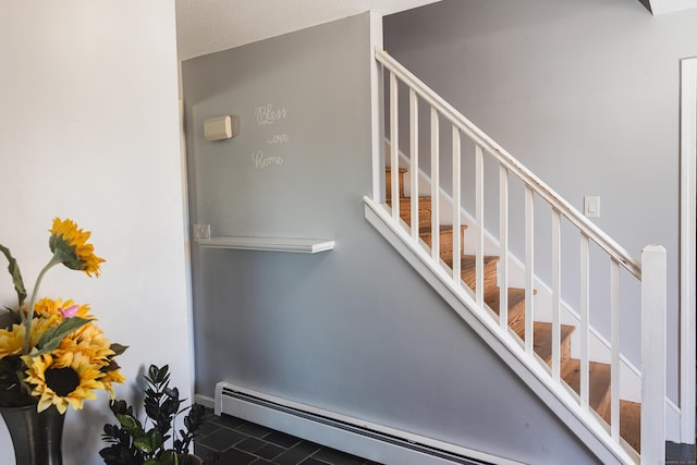 interior space with a baseboard radiator and baseboards