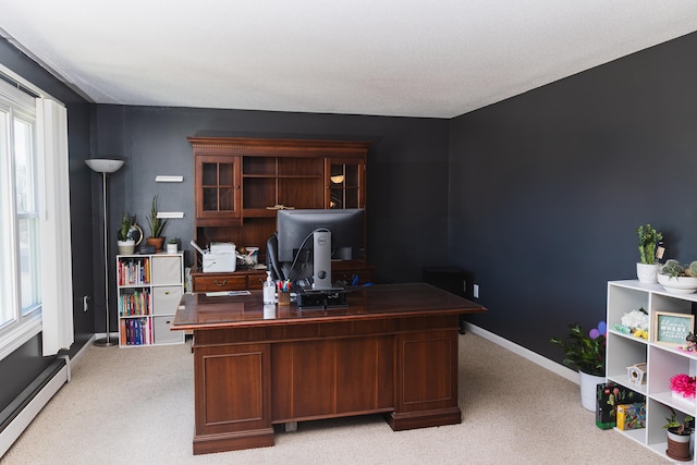 office area featuring baseboards, light carpet, and baseboard heating