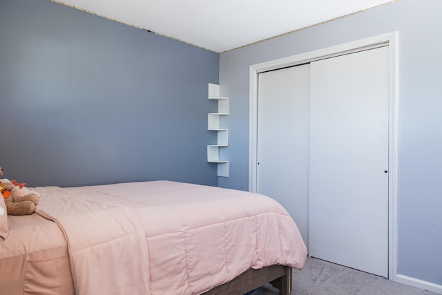 bedroom with carpet floors and a closet