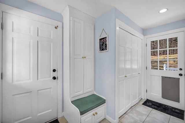 interior space with light tile patterned floors