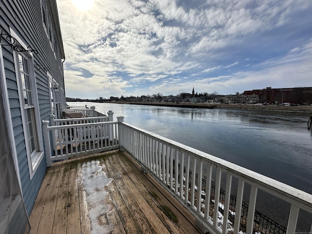 wooden terrace with a water view