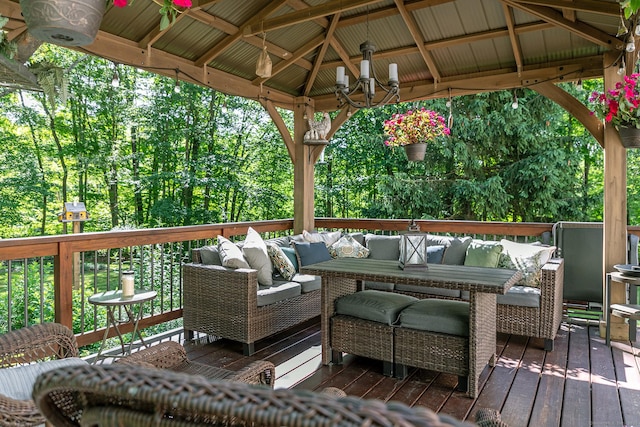 wooden deck featuring an outdoor living space and a gazebo