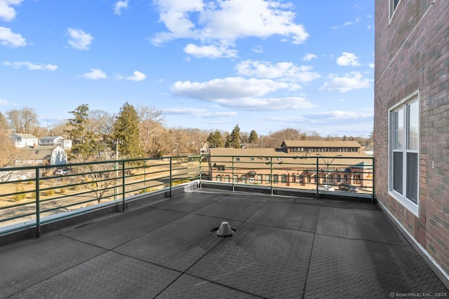 view of patio featuring a balcony