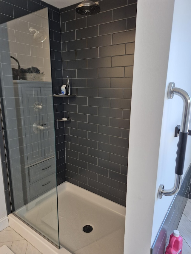 full bath with a shower stall