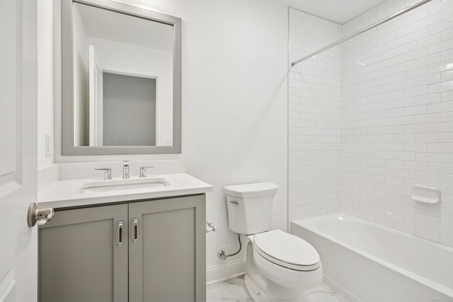 bathroom with toilet, bathing tub / shower combination, vanity, baseboards, and marble finish floor