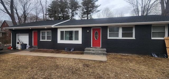 ranch-style house with entry steps and brick siding