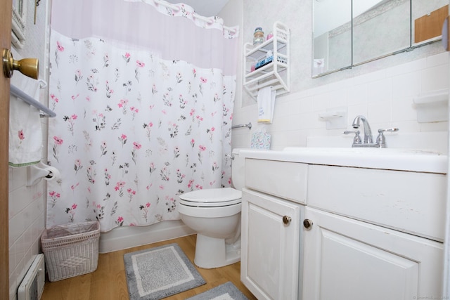 full bath featuring tile walls, toilet, wood finished floors, and visible vents