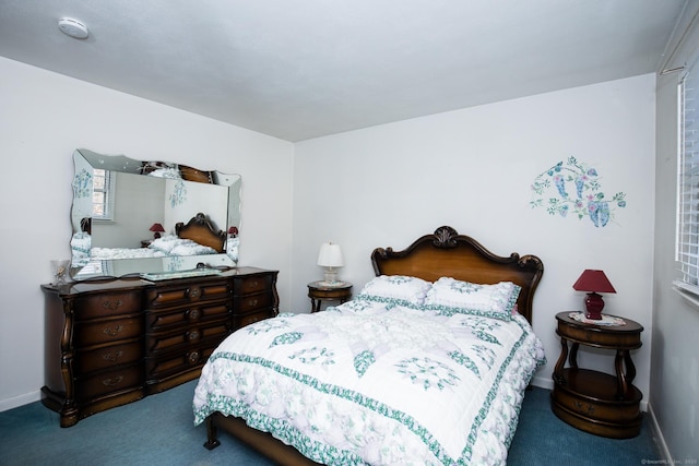 bedroom featuring baseboards and carpet floors