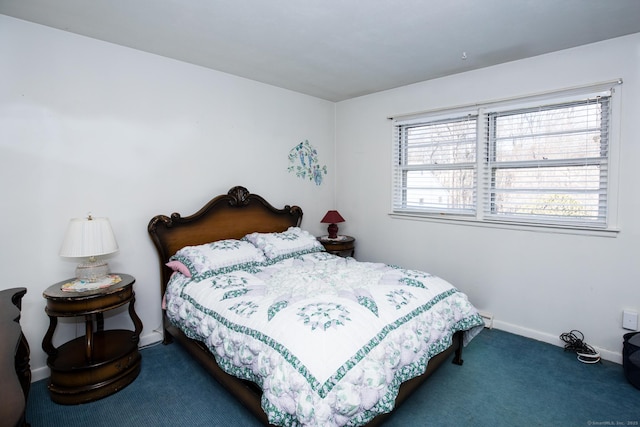 carpeted bedroom featuring baseboards