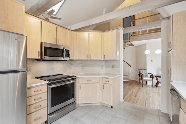 kitchen featuring stainless steel appliances, light brown cabinetry, light countertops, and decorative backsplash