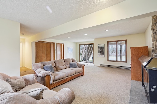 living area with a textured ceiling, baseboard heating, recessed lighting, and light colored carpet