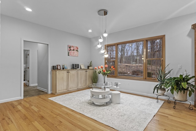 sitting room with baseboards, recessed lighting, and light wood-style floors