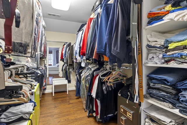 walk in closet featuring wood finished floors and visible vents