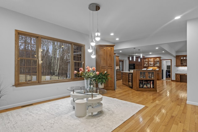 interior space with recessed lighting, visible vents, light wood-style flooring, and baseboards