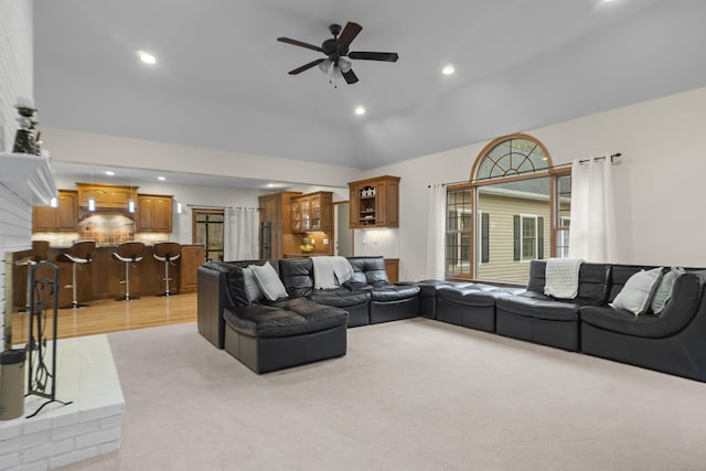 living room with recessed lighting, light carpet, ceiling fan, and lofted ceiling