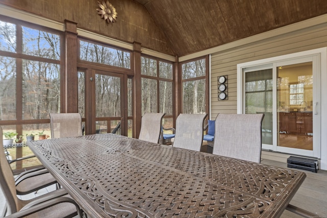 sunroom with lofted ceiling and wooden ceiling