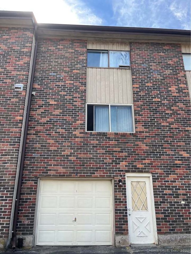 view of property exterior featuring an attached garage