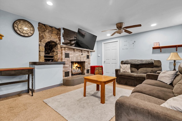 living area featuring recessed lighting, a fireplace, carpet flooring, a ceiling fan, and baseboards