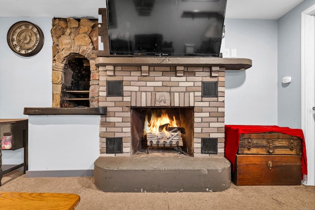 details featuring carpet floors and a brick fireplace