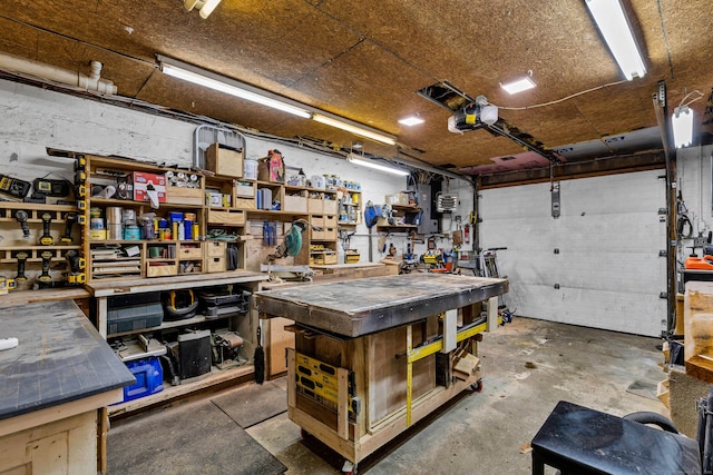 garage featuring a workshop area and a garage door opener