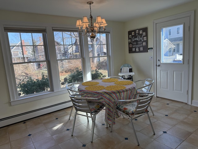 dining space with a chandelier and a baseboard radiator