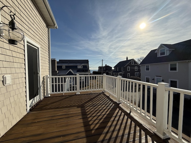 wooden terrace with a residential view