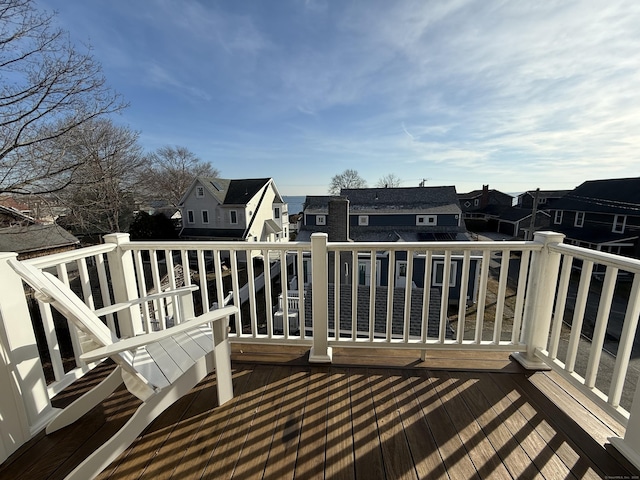 wooden terrace featuring a residential view