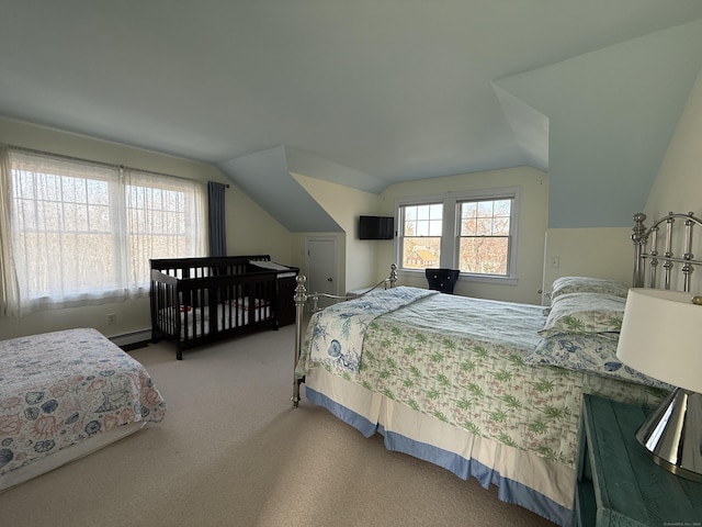 bedroom featuring carpet, baseboard heating, and vaulted ceiling