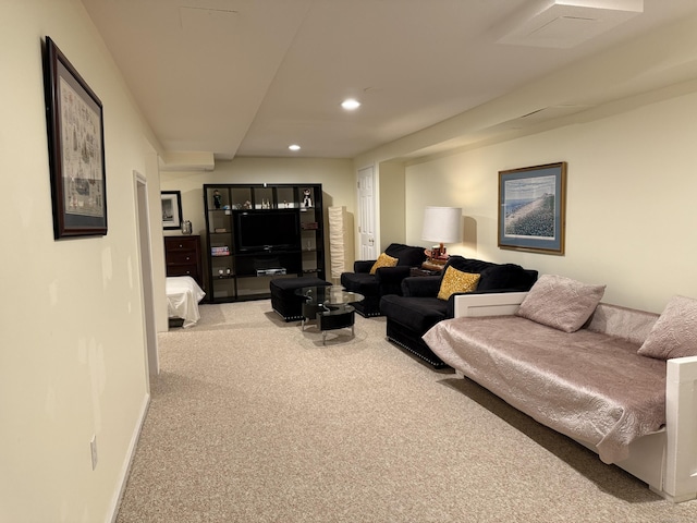 carpeted living room with recessed lighting and baseboards