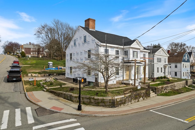 108 Thames St, Groton, CT 06340 - view of front facade with a chimney and a residential view
