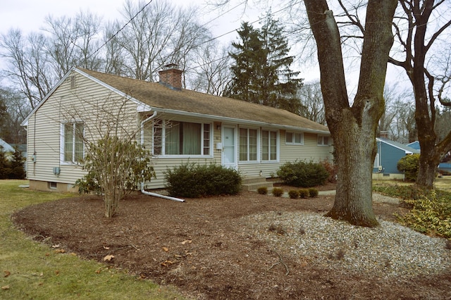 ranch-style house with a chimney