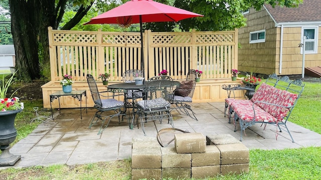 view of patio with fence and outdoor dining area