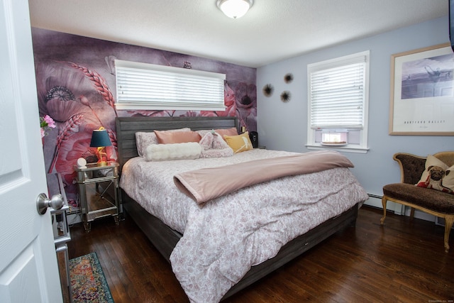 bedroom featuring multiple windows and hardwood / wood-style floors