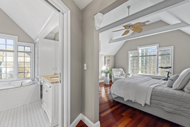 bedroom featuring multiple windows, vaulted ceiling with beams, and baseboards