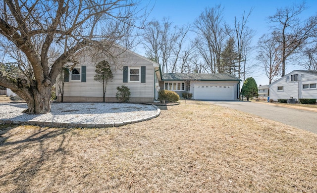 view of front of property with driveway and a garage