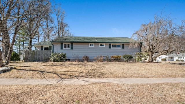 view of front of house featuring fence