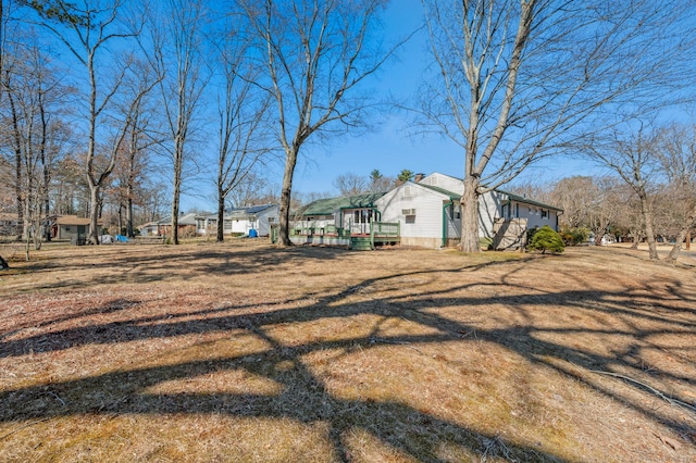 view of yard with a wooden deck