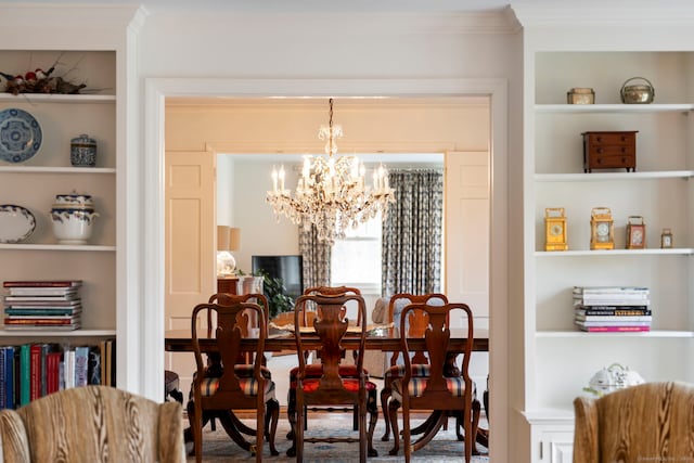 dining space with an inviting chandelier, built in shelves, and crown molding