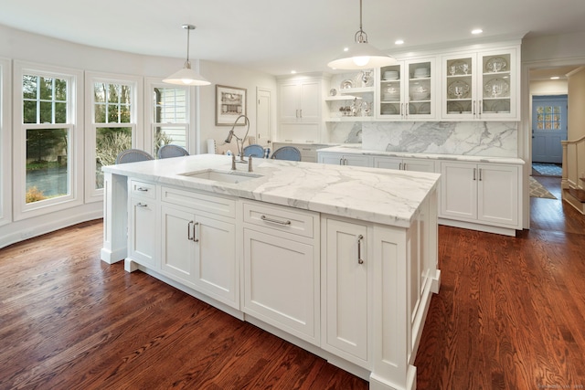 kitchen featuring pendant lighting, white cabinets, and dark wood-type flooring