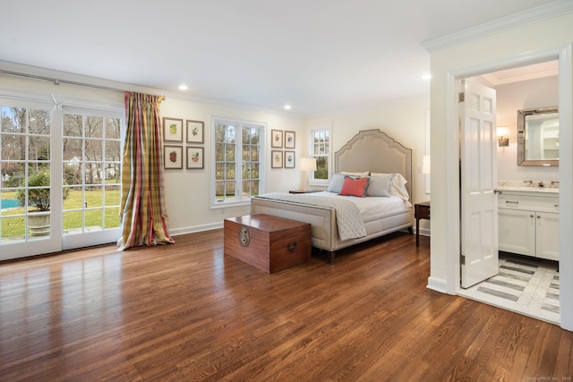 bedroom featuring dark wood-style flooring, ornamental molding, multiple windows, and recessed lighting