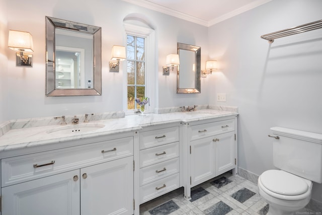 full bath featuring toilet, double vanity, ornamental molding, and a sink